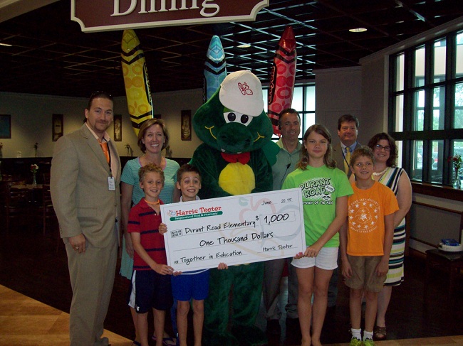 Harris Teeter Store Director Tony Seidner presented Durant Road Elementary School with a $1,000 check 