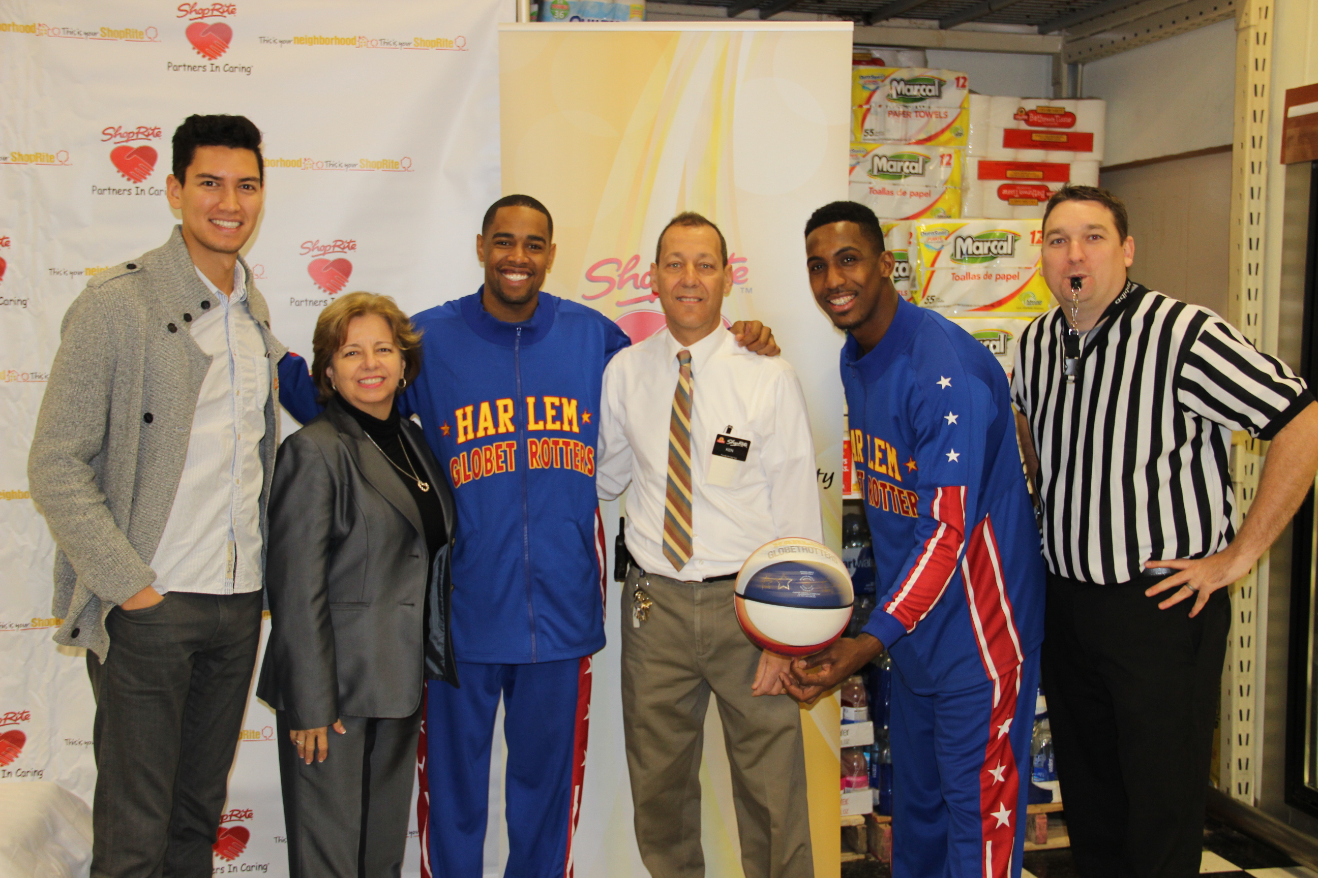 From L to R: Kenji Hoffman, corporate campaigns associate, Food Bank for New York City, Chris Magyarits, community relations manager, ShopRite, Cheese Chisholm, guard, Harlem Globetrotters, Ken Grillo, assistant manager, ShopRite of Forest and Richmond, Bull Bullard, guard, Harlem Globetrotters, Steve Hildner, community relations advocate for ShopRite.   