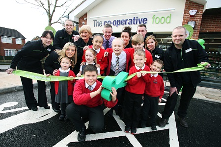© Neil O Conner/ UNP 0845 600 7737 Co-Op 33439 Heathcote Street, Longton  Stoke on Trent Manager Dan Golding and staff join Children from Sandford Hill Primary School for the ribbon cutting. Ribbon is cut by Callum Johnson age 11