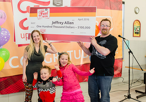 Co-op customer and member Jeffrey Allen celebrates his 2016 Fuel Up to Win grand prize with his family at the Delta Co-op Food Store in Unity, Sask.